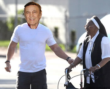 John Metelsky helping a nun cross the street